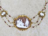 a picture of a necklace with a picture of a man and woman on it
