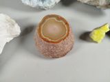 a small piece of rock with a stone inside of it