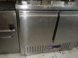 a picture of a commercial kitchen with stainless steel appliances