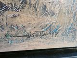 a close up of a painting of a bird on a table
