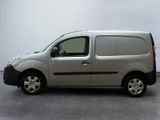 the silver van is parked on the concrete floor in the room