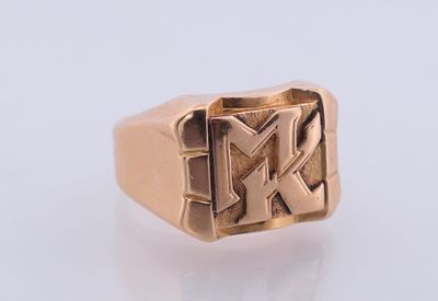 an image of a gold signet ring with the letter k on it