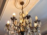 a chandelier hanging from the ceiling in a room