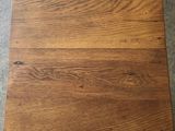 a close up of a wooden floor with a brown stain