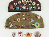several military badges and badges are laid out on a bag