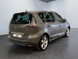 the back of a silver car is parked in a garage