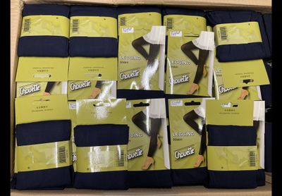 boxes of women ' s tights and stockings are stacked on top of each other
