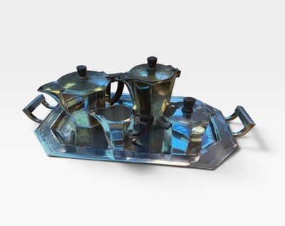 a tray with a tea set on it on a white surface