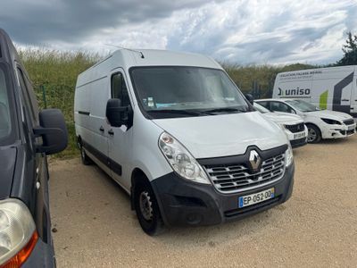 a white van parked in a parking lot with other vehicles