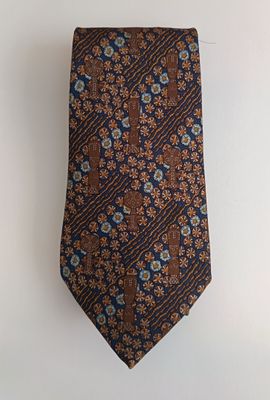 an image of a tie hanging on a wall with a white background