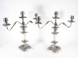 pair of silver plated candelabs with candlesticks on stands