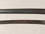 two knives that are sitting on a table