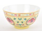 a yellow bowl with a floral design on it