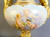 a vase with a painting of cherensils on it