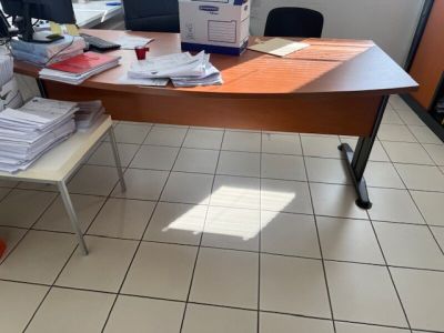 a desk with a lot of papers on it