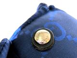 a coin sitting on top of a blue pillow