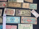 several different types of paper money laid out on a table