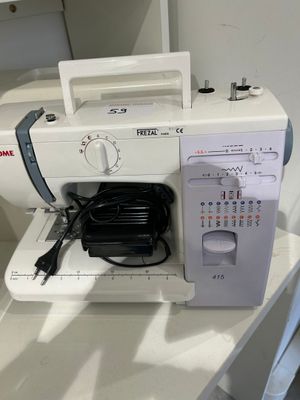 a sewing machine that is sitting on a table