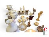 many different types of vases and bowls on the table