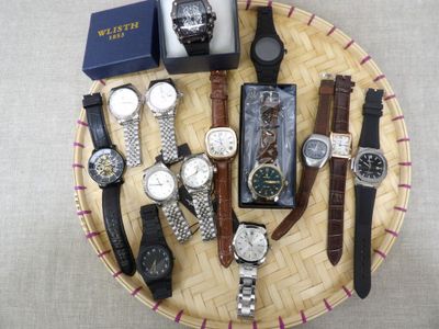 a lot of watches on a basket on the table