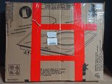 a cardboard box with a red tape wrapped around it