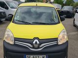 yellow and black van parked in a parking lot next to other cars