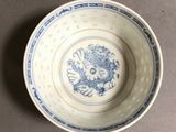 a blue and white bowl sitting on a table