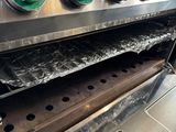 a close up of an oven with a lot of food inside of it