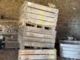 a pile of wooden pallets sitting in a room