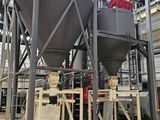 an industrial machine is in a large building with a lot of machinery