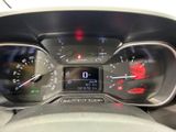 a close up of a car dashboard with a speedometer