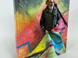a book with a picture of a man holding a scarf