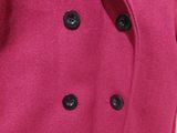 a close up of a pink coat with black buttons on a mannequin mannequin mannequin mannequin mannequin mannequin manne
