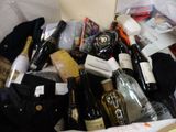 many bottles of wine in a white bag on the floor