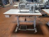 an image of a sewing machine sitting on top of a table