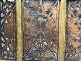 a wooden chest with a carved design on it