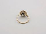 an image of a gold ring with a flower design on it