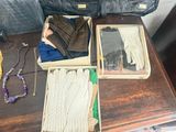 two boxes with gloves, gloves, and other items on a table