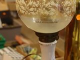 a table with a lamp that is sitting on top of it