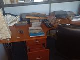 a desk with a computer and a keyboard on it