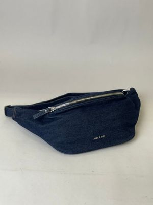 a blue fanny bag sitting on a white surface