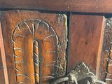 a wooden cabinet with a metal handle on it