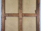 an old wooden frame with writing on it sitting on a table