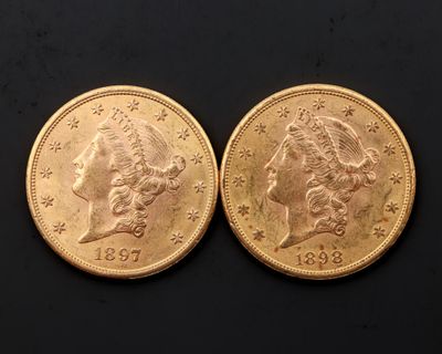 deux pièces d'or, l'une représentant une femme et l'autre un homme