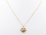 a gold heart shaped locke necklace on a mannequin mannequin mannequin mannequin mannequin mannequin mannequin mannequin