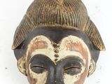 an image of a wooden mask on a white background