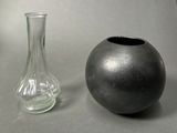 two vases sitting next to each other on a table