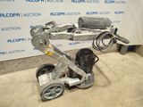 a machine that is sitting on the ground in front of a wall