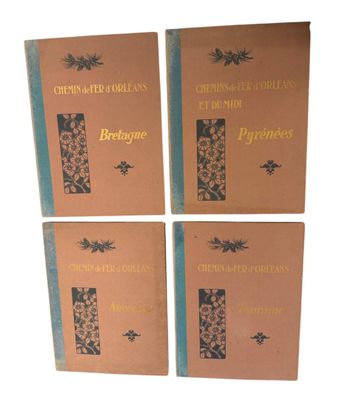 four books are lined up in a row on a white surface