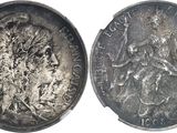 une vieille pièce d'argent sur laquelle figure l'effigie d'une femme